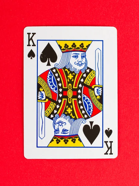Old playing card (king) isolated on a red background — Stock Photo, Image