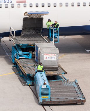 Boeing 767-332ER of Delta is being loaded clipart