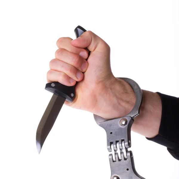 Male with a sharp knife in it's hand with a handcuff — Stock Photo, Image