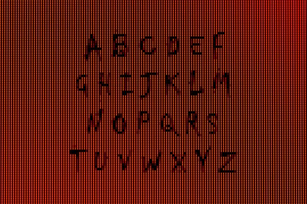 Het alfabet in close-up op een computerscherm — Stockfoto