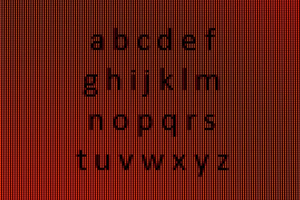 O alfabeto em close-up em uma tela de computador — Fotografia de Stock