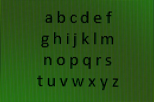 O alfabeto em close-up em uma tela de computador — Fotografia de Stock