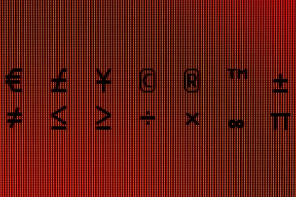 Símbolos em close-up em uma tela do computador — Fotografia de Stock