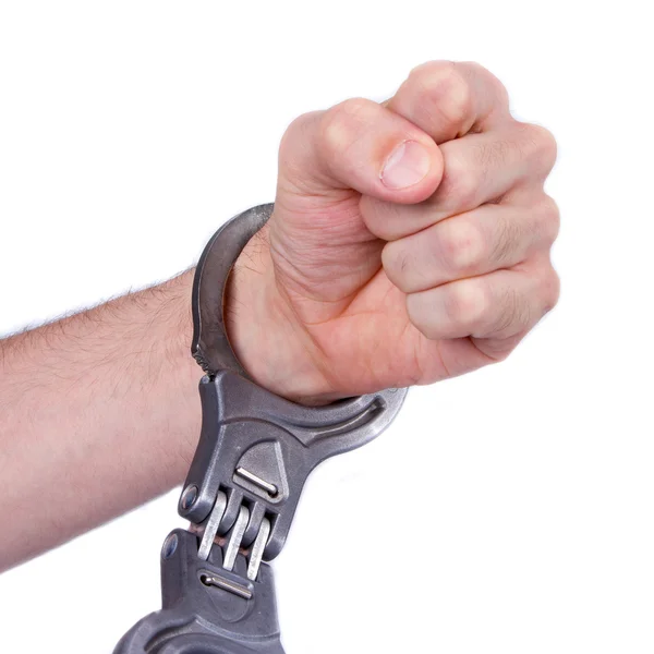 A man in metal handcuffs on a white background — Stock Photo, Image