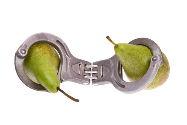Pears caught in handcuffs — Stock Photo, Image