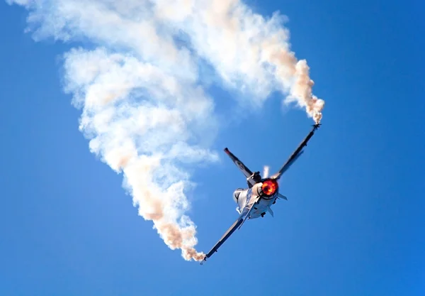 stock image F16 fighter plane maneuver