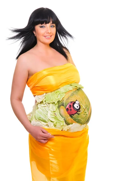 Gravid kvinna klädd i gul vävnad — Stockfoto