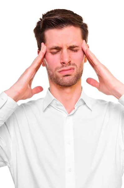 A young man grasping his head — Stock Photo, Image