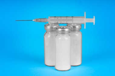 Syringe and vials for injection clipart