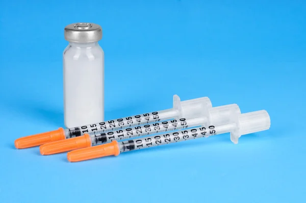 Syringes and a bottle — Stock Photo, Image
