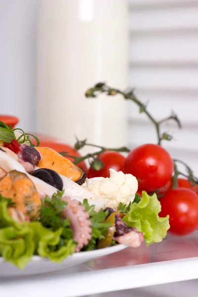 Salad of seafood decorated tomatoes — Stock Photo, Image