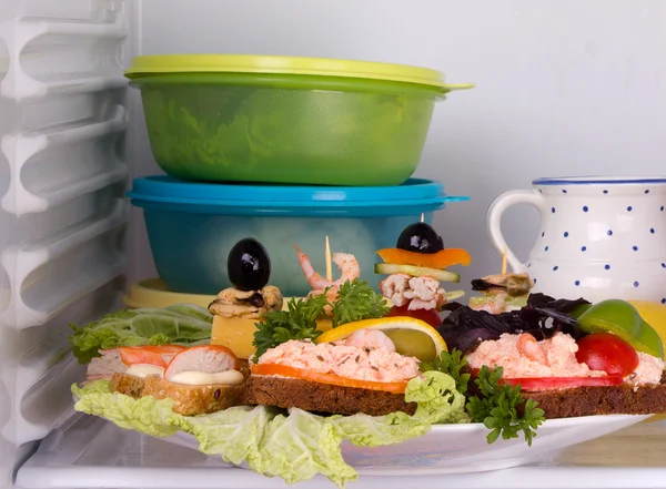 Seafood sandwich and canapés in the fridge — Stock Photo, Image