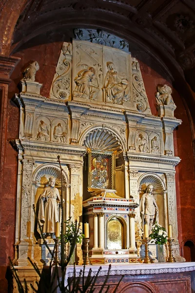 stock image God's mother framed with sculptures inside of cathedral