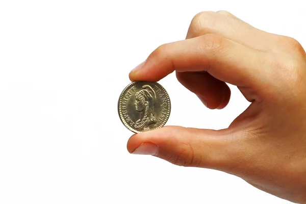 Moneda en la mano de un hombre — Foto de Stock