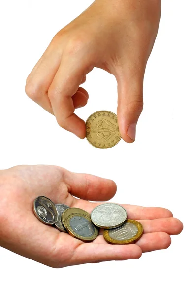 Mano puting monedas en una palma — Foto de Stock