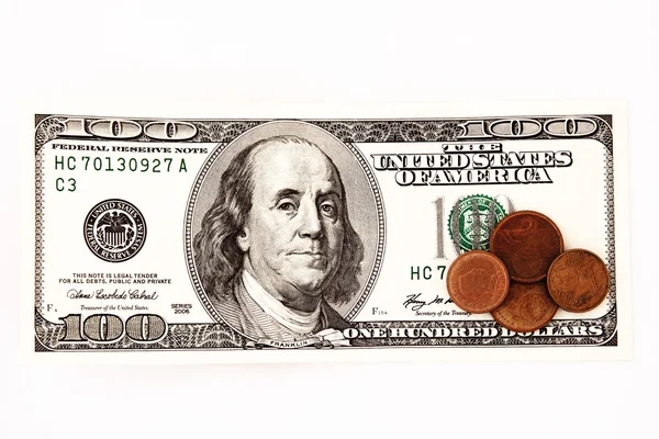 Hundred dollar bill and coins — Stock Photo, Image