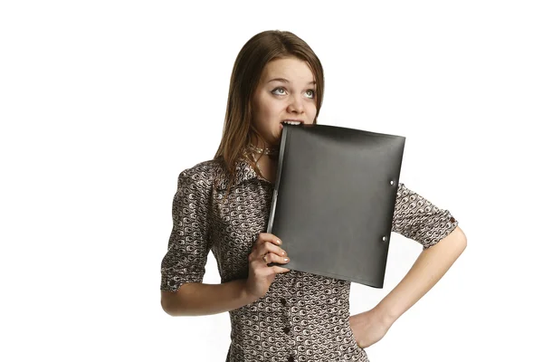Girl biting a folder — Stock Photo, Image