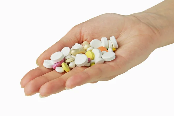 Woman's hand full of tablets — Stock Photo, Image
