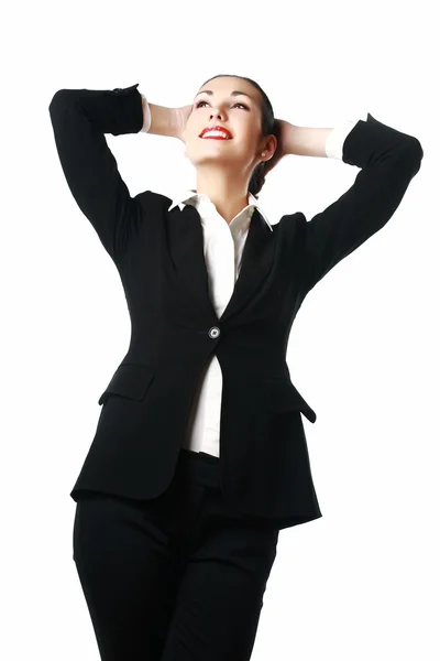 Tevreden zakenvrouw met handen achter haar hoofd — Stockfoto