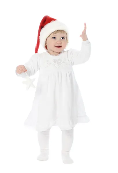 Симпатичный ребенок в сантовской шляпе — стоковое фото