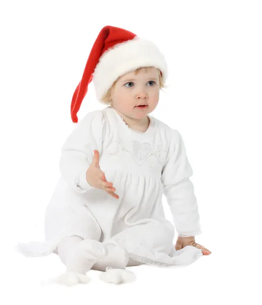可爱的小宝宝戴着圣诞礼帽 图库图片