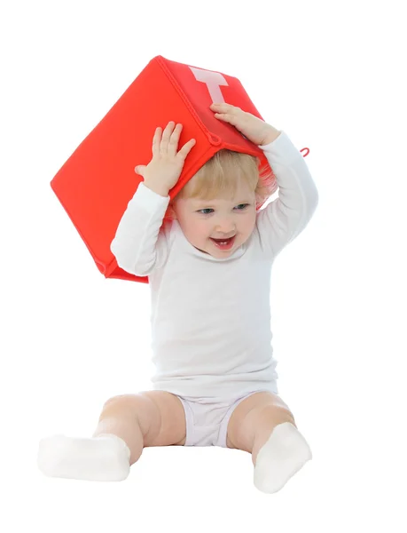 Baby with red box isolated on white — Stock Photo, Image
