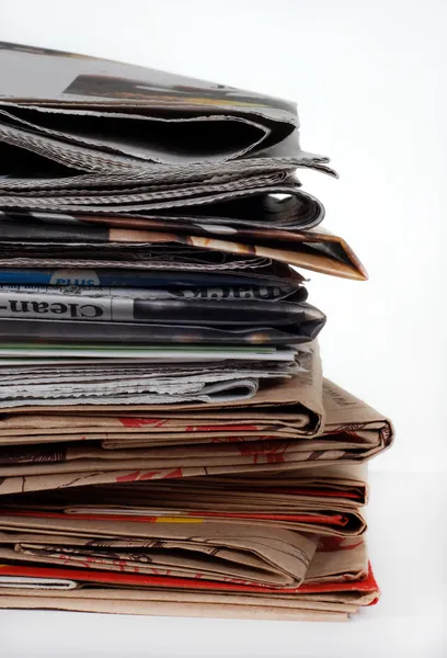 stock image Stack of newspapers and bags