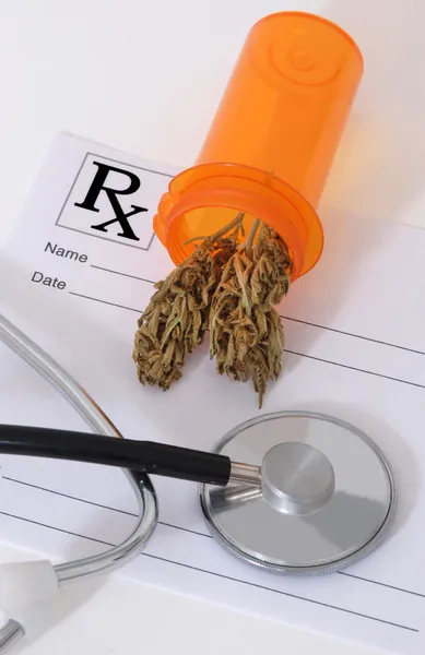 Cannabis bud near medical items — Stock Photo, Image