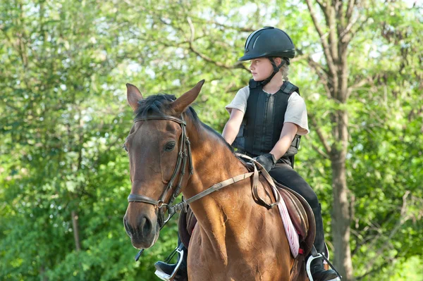 Girl riding a horse — Stock Photo, Image