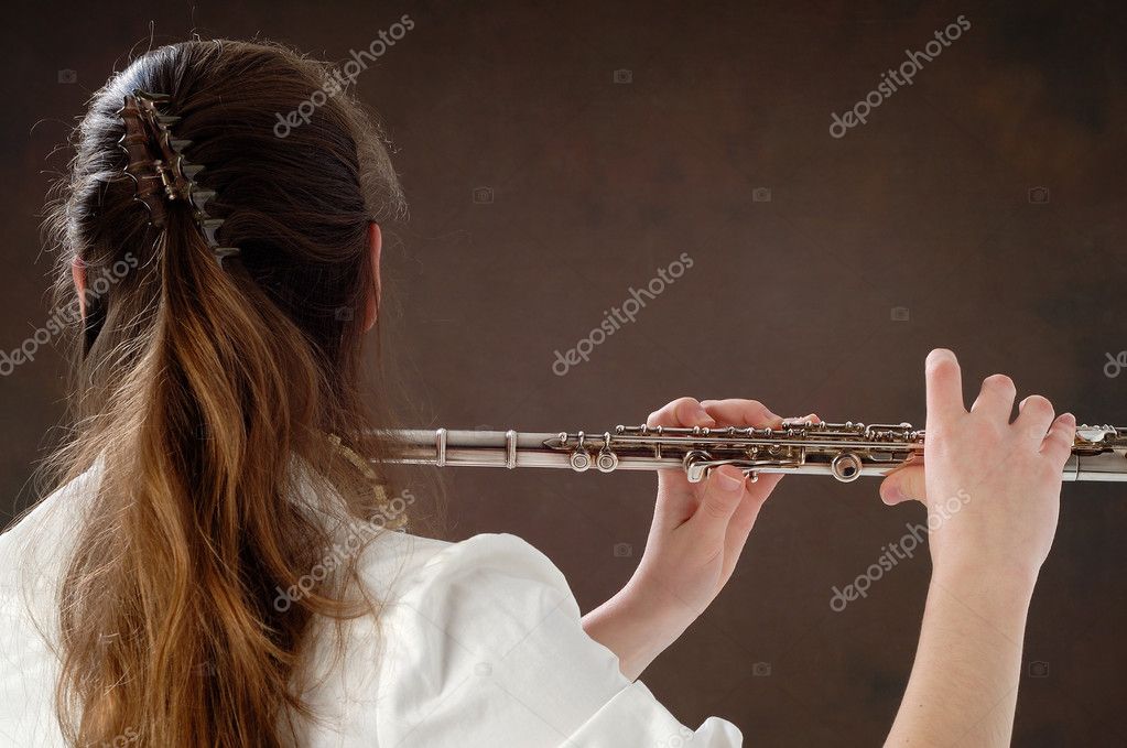 ●₪ مــــــزاجك "بصـــــورة" ₪● - صفحة 78 Depositphotos_9538597-stock-photo-young-girl-playing-the-flute