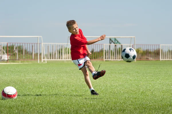 Kicking soccer ball — Stock Photo, Image