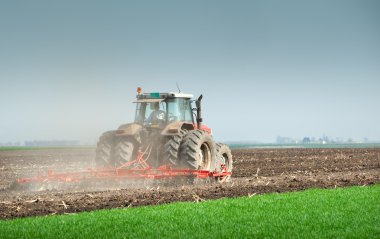 Tractor plowing clipart