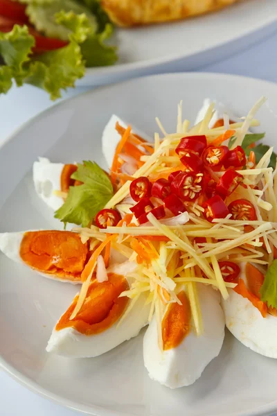 Boiled salted eggs with spicy toppings — Stock Photo, Image