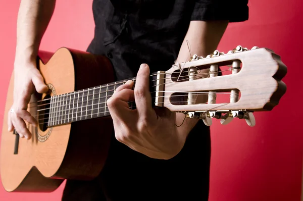 Stock image Young boy playing the guitar