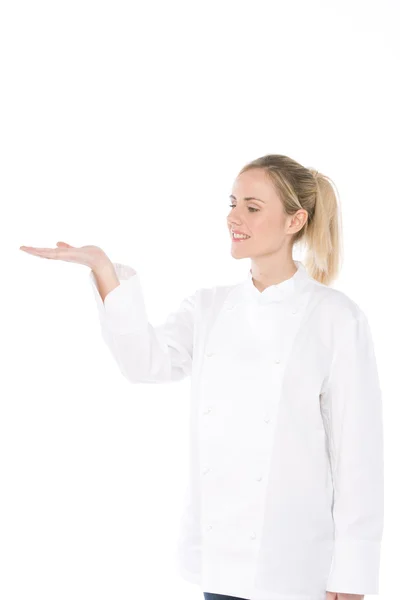 Vrouw chef-kok geïsoleerd op wit met open palm.room voor objecten — Stockfoto