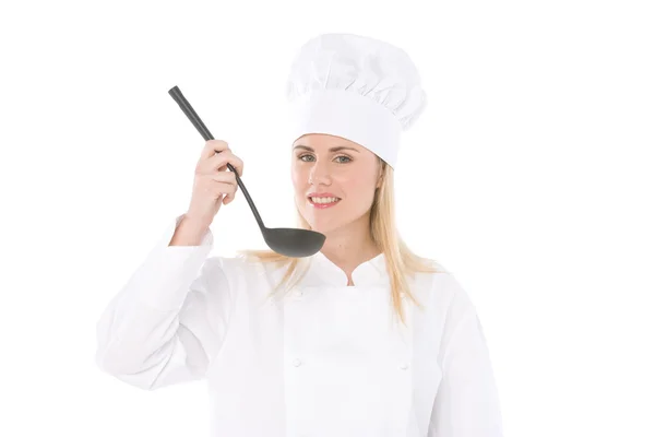 Woman chef holding a spoon isolated on white — Stock Photo, Image