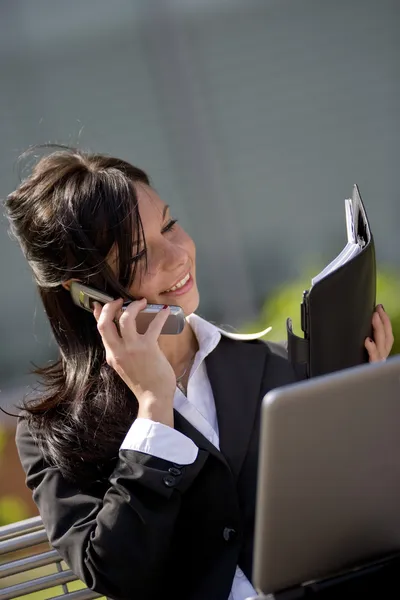 Young businesswoman taking appointment outdoors — Stock Photo, Image