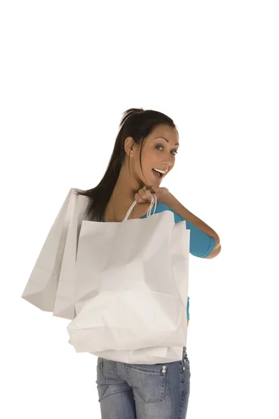 Fiatal nő, bevásárló táskák hátulról — Stock Fotó