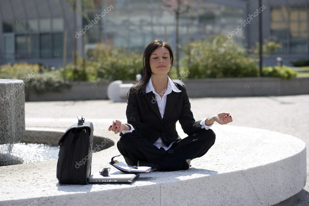 Young businesswoman take a break in a zen position