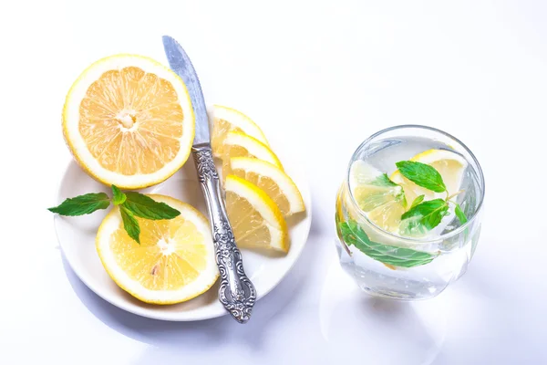 stock image Cold, fresh clean water with slices of lemon and mint.