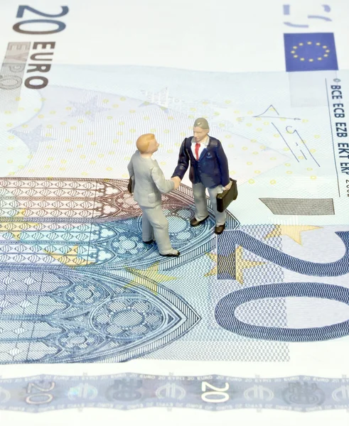 Miniature handshake twenty euros — Stock Photo, Image