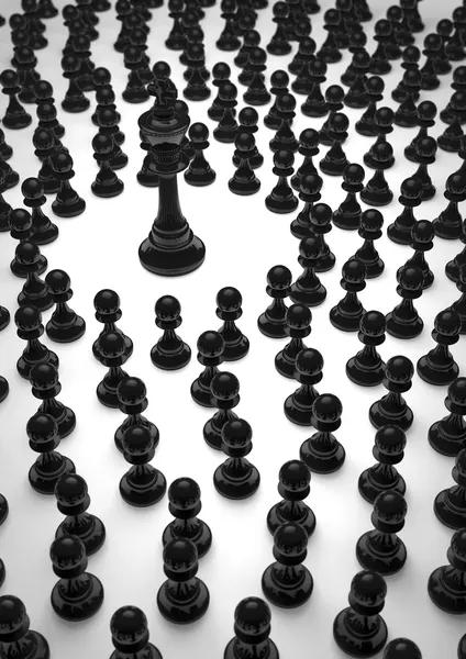 Шахматный черный король и пешки — стоковое фото