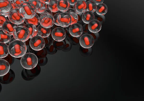 Glass marbles with red pill inside — Stock Photo, Image
