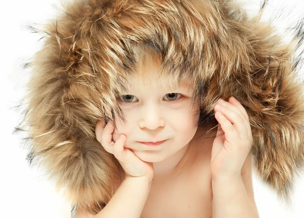 Little boy in a furry hood — Stock Photo, Image