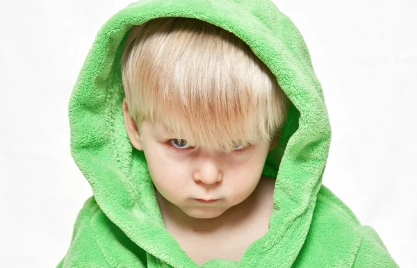 Serious boy in green dressing gown — Stock Photo, Image