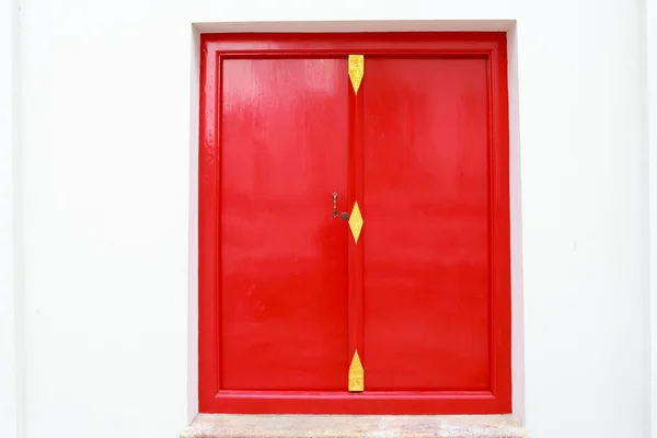 stock image Red window in the temple .