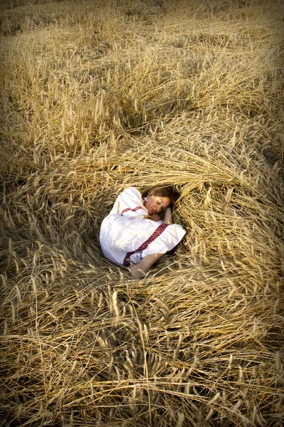 Portrait of a young women on a field — Stock Photo, Image