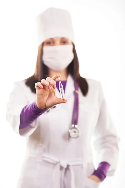 Young caring doctor or health care worker in white uniform, with — Stock Photo, Image