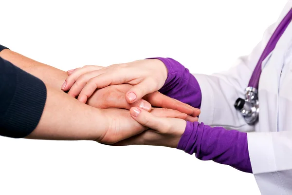 Hålla patientens hand, ger hjälp Stockfoto