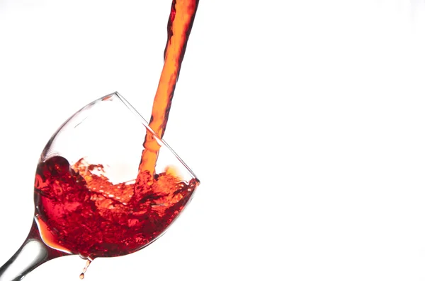 Strawberry splashing into a wine glass — Stock Photo, Image
